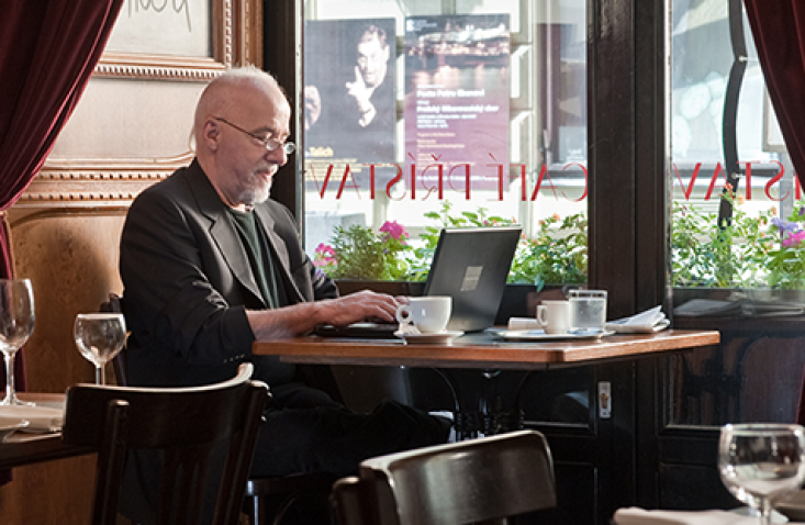 Paulo Coelho at work during a visit to Prague.