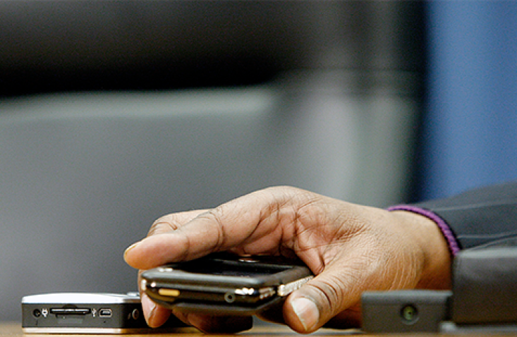 Stevie Wonder holds a colour identifier device for the blind and visually impaired during a press conference at United Nations Headquarters in New York. UN Photo/Mark Garten