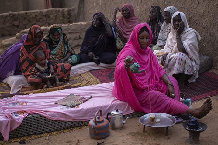 Women from the Songhai and Bella ethnic groups share a moment of relaxation, drinking tea in Gao, Mali