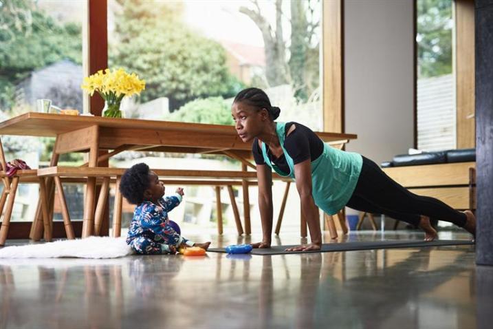 woman with baby doing yoga