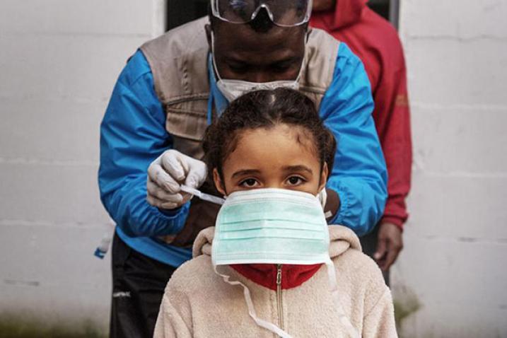 Medical worker and girl with mask