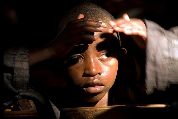 One of the many children in the audience during the screening of a documentary film on the repatriation of former combatants to Rwanda. 