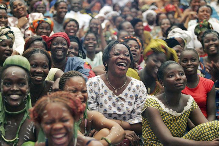 A crowd of women sitting and laughing