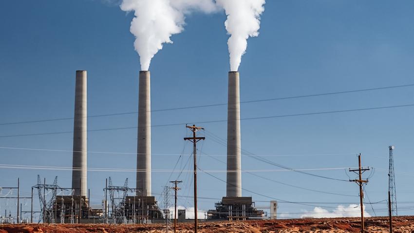 The NDC synthesis report is prepared in response to the requests from COP 21 (Paris, 2015) and CMA 2 (Madrid, 2019) to the secretariat to prepare a synthesis report of the NDCs submitted by Parties before COP 26 A smokestack industry is shown, with a lot of smoke going from the chimneys to the sky.