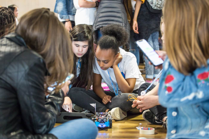Girls performing an experiment.