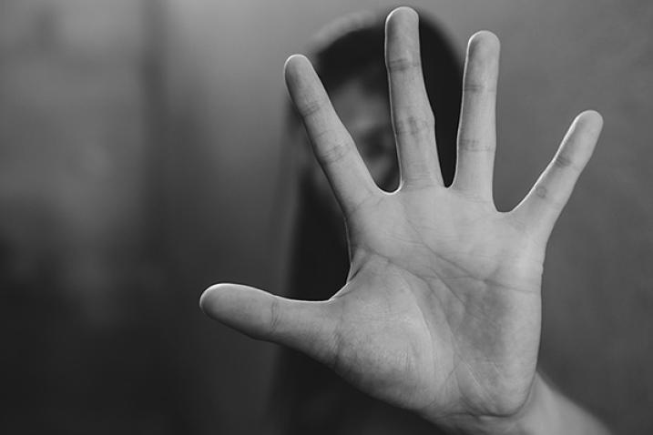 Woman making NO or STOP gesture with hand