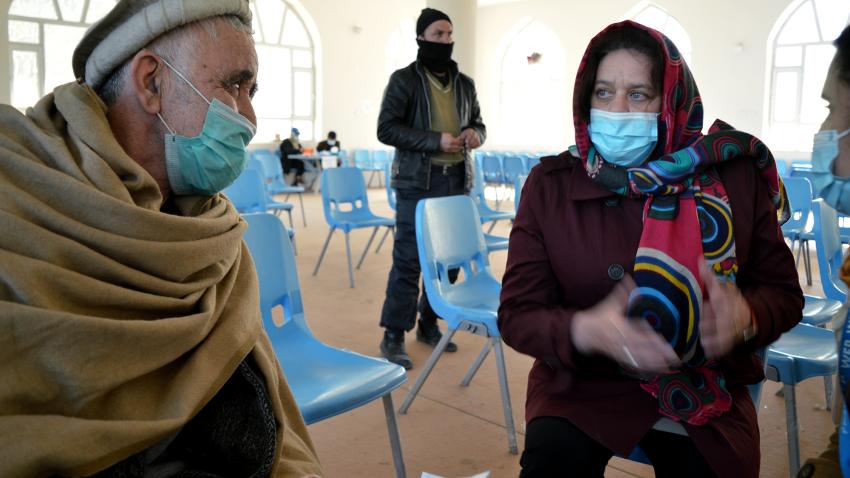 Mary-Ellen McGroarty is talking to an Afghani man