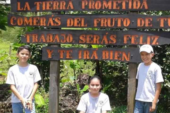 volunters in front of a sign