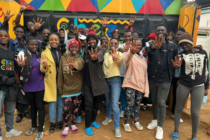 Doris, Francis and Cynthia pose with young people in Kibera, Kenya