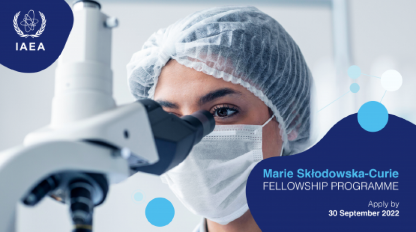 Woman looking into microscope