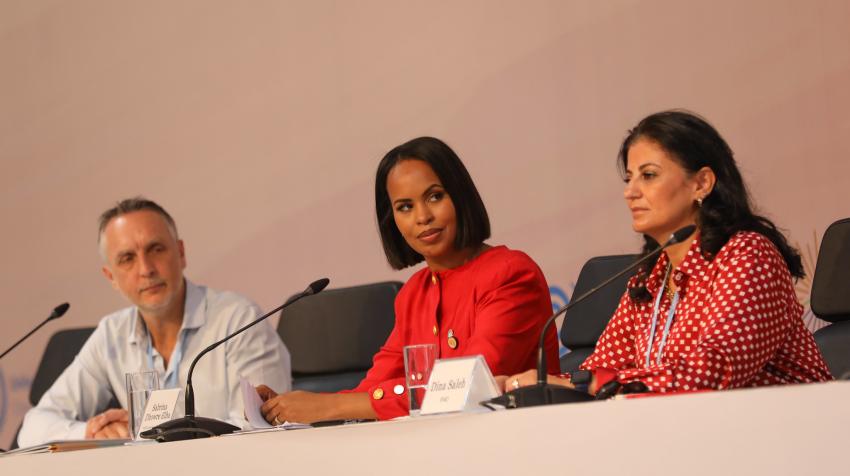 A photo of Sabrina Dhowre Elba on a conference table during COP27