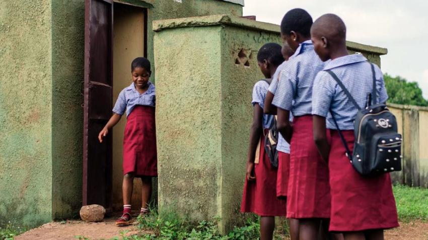 © UNICEF/Adzape Children use toilet facilities at a school in Nigeria.