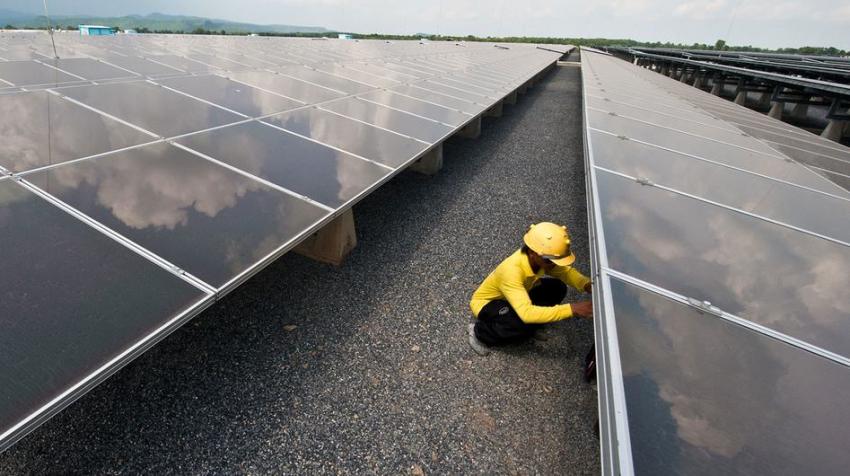 © ADB. A technician works at a solar panel plant in Thailand.