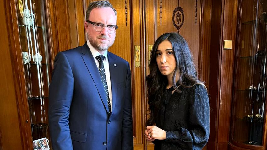 Christian poses for a photo with Nadia Murad