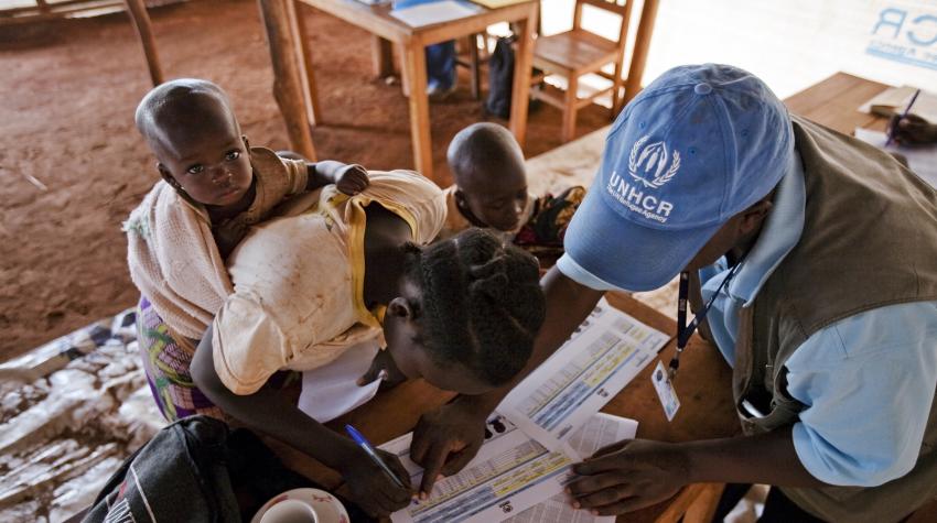 A Congolese woman at a refugee camp in Burundi is with her children, registering with the UN High Commissioner for Refugees for voluntary repatriation to the Democratic Republic of Congo. 