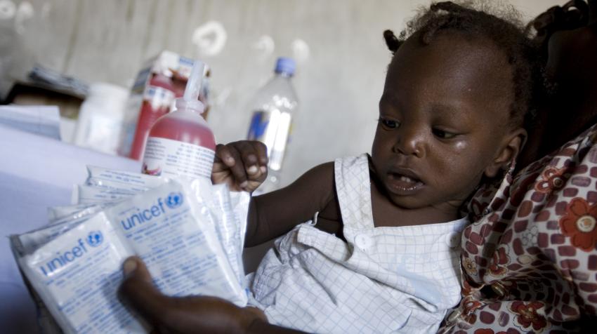 A child at the health center in Haiti is receiving oral re-hydration salts administred by the United Nations Children's Fund during the cholera outbreak.
