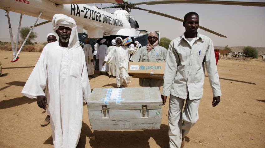 People from the UNAMID mission in Darfur, Office for the Coordination of Humanitarian Affiars, and the UN Children's Fund are unloading food and medical aid. 