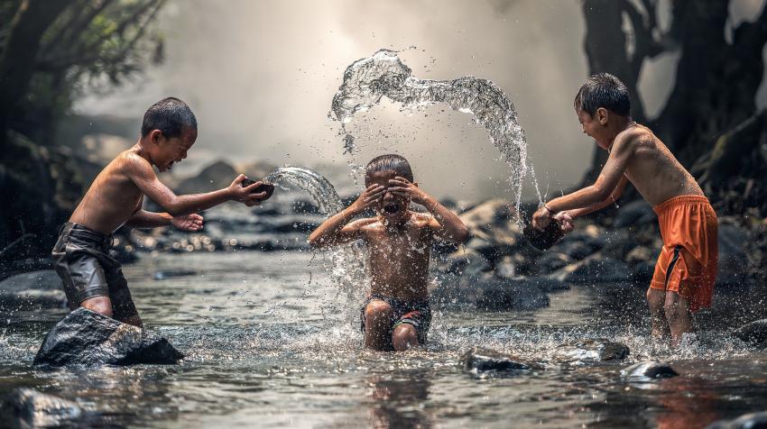 Boys playing in a stream, 6 March 2016. Photo by Sasin Tipchai from Pixabay. 