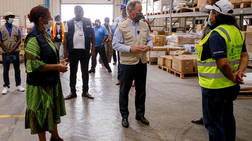 David Beasley inspects a storage facility with colleagues at hand.