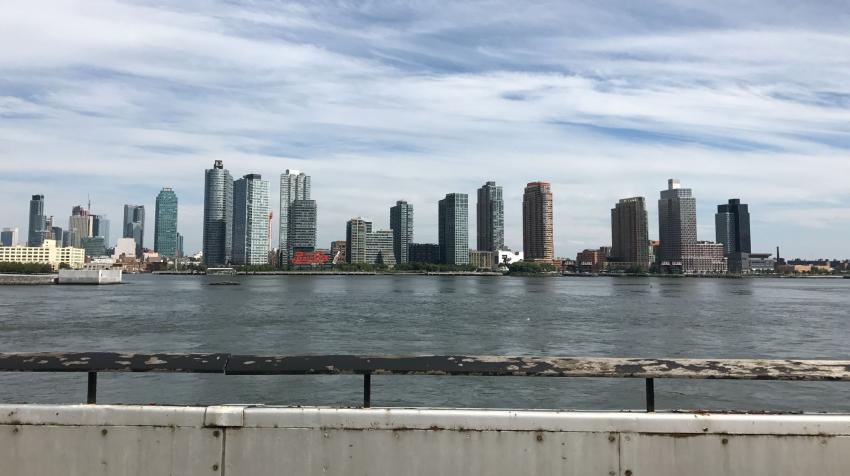 View of the east river and Long Island City from the patio of the green area. 