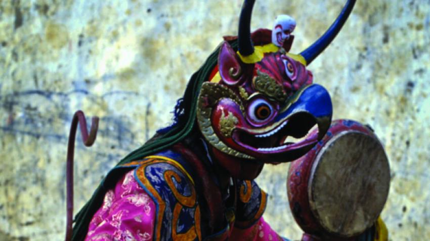 A Bhutanese dancer doing a traditional dance on the streets of Bhutan. ©ASIAN DEVELOPMENT BANK