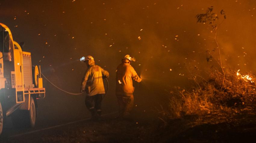 Firefighters in Queensland, Australia, tackle a blaze in January 2020