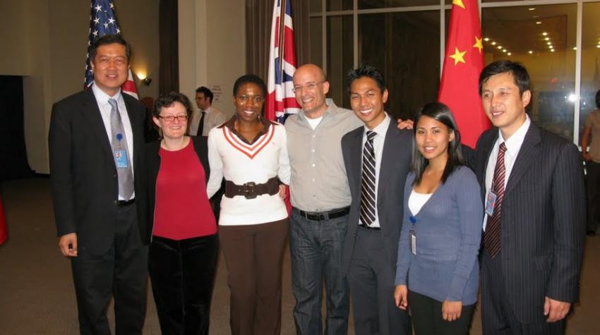 Group of people standing for a group photo. 