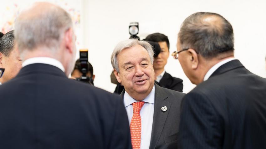 Secretary-General António Guterres speaks to dignitaries.