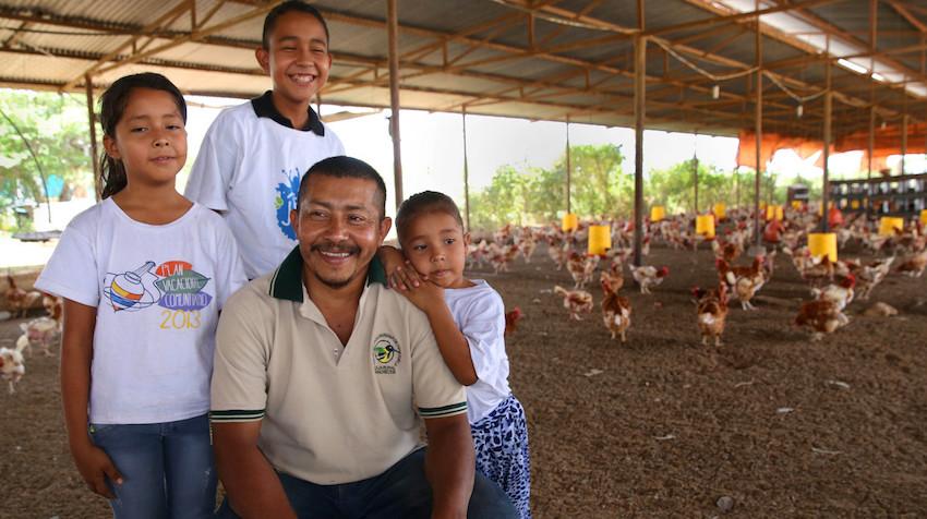 Image of family at their chicken farm