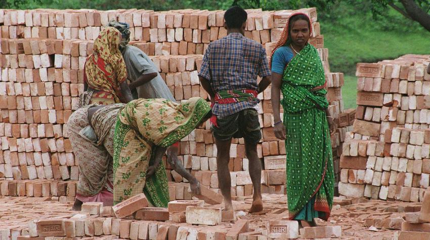 World Bank/Scott Wallace: Workers stack bricks at a factory near Dhaka in Bangladesh.