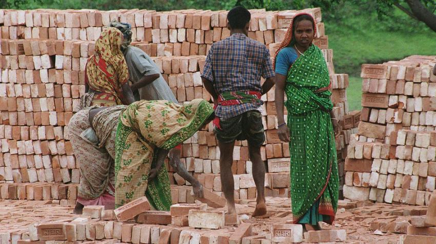 World Bank/Scott Wallace: Workers stack bricks at a factory near Dhaka in Bangladesh.