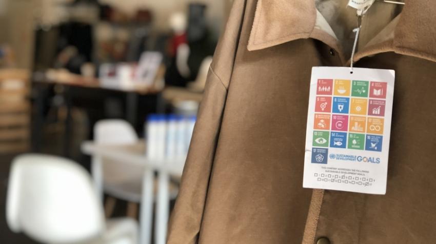 Sustainable Development Goals tags on display at a clothing donation event hosted by The Canvas during the ReFashion Week. 