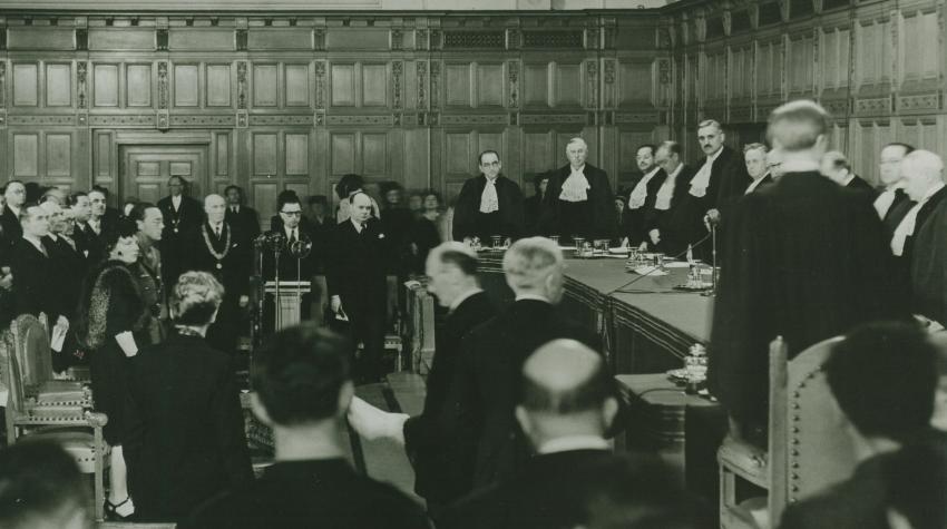 The inaugural sitting of the International Court of Justice, held on 18 April 1946 in the Great Hall of Justice of the Peace Palace, The Hague (ICJ archives).