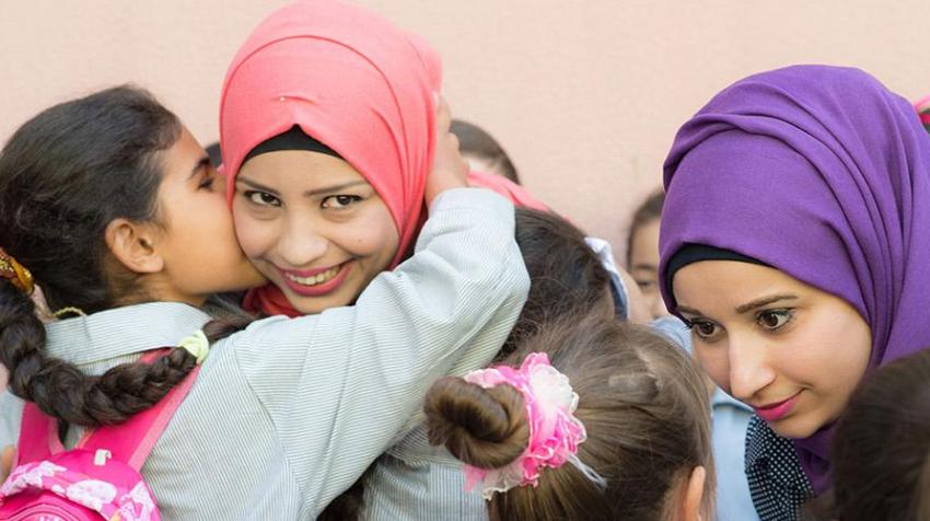 UN Volunteer teachers talk to students at Ramallah School in Chatila Palestinian Refugee camp. 