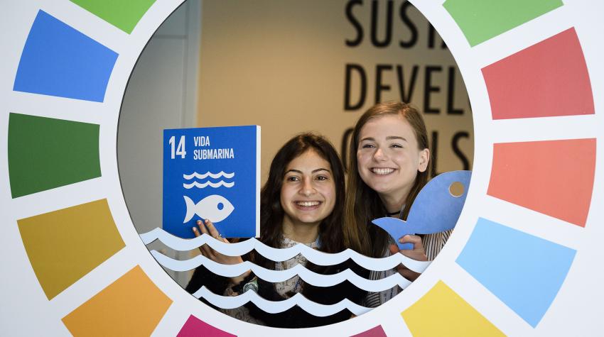 Visitors to the UN Ocean Conference pose for a picture inside of a display about the Sustainable Development Goals at UN headquarters in New York from 5 to 9 June 2017. 