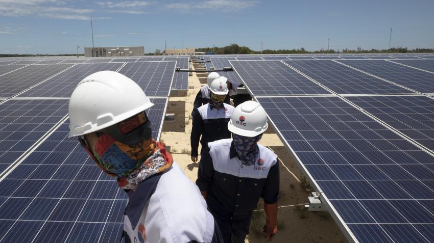 workers on solar panel roof