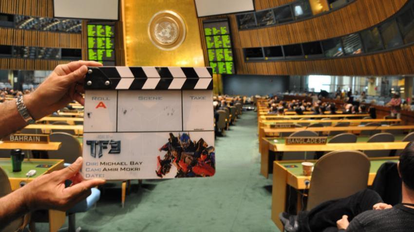 Person holding clapperboard in General Assembly Hall 