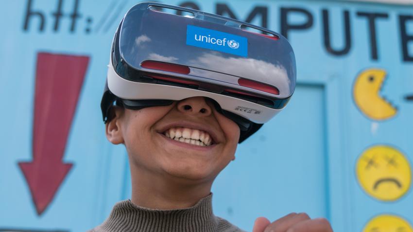 Mansoor, 12, watches the virtual reality documentary ‘Clouds over Sidra’ outside a UNICEF-supported Makani centre in the Za’atari camp for Syrian refugees, near the Syrian border in Mafraq Governorate, Jordan. © UNICEF/Herwig