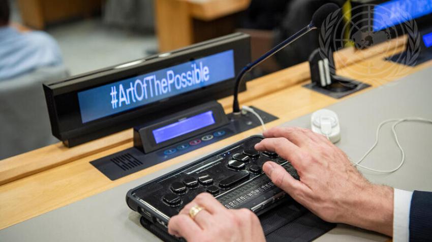 A participant using his Braille keyboard during the special event "The Art of the Possible", on the occasion of the International Day of Persons with Disabilities. United Nations, New York, 3 December 2018. UN Photo/Manuel Elías