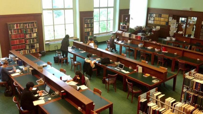 Bird's Eye view of the library with study desks and book shelves. 