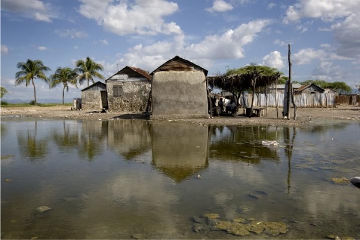 House surrounded by flooding from the Artibonite River in Grand Dessalines, Haiti.