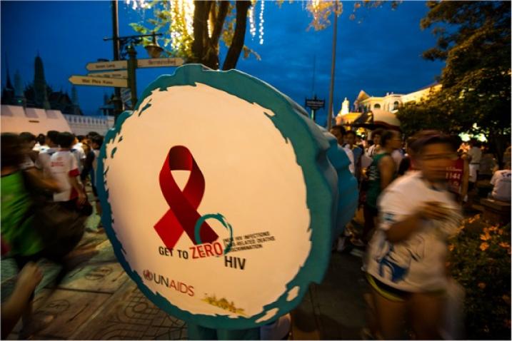 Person disguised as a drum with the slogan Getting to Zero HIV in Bangkok, Thailand.
