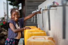 Marie, 7, draws water from a standpipe built with the support of UNICEF in the Buhene district of Goma, capital of North Kivu province, Democratic Republic of Congo. UNICEF/Gwenn Dubourthoumieu 