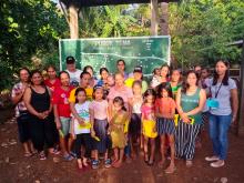 Caregivers and their children in Palawan, the Philippines, pose for a group photo during a training of families in the United Nations Office on Drugs and Crime (UNODC) Strong Families programme. UNODC