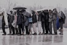 A group of men from Asia stranded in Bosnia and Herzegovina wait for assistance from the International Organization for Migration (IOM). © IOM 2020