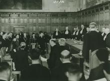 The inaugural sitting of the International Court of Justice, held on 18 April 1946 in the Great Hall of Justice of the Peace Palace, The Hague (ICJ archives).