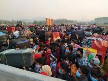 crowd of people with suitcases