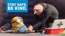 Cartoon character Gru helps minion who fell off his bike