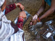 Savita Devi, an Accredited Social Health Activist, demonstrates hand-washing techniques to Mamta during Home-Based Newborn Care in Ahiran Purwa Barkat, Chitrakoot, Uttar Pradesh, India. 24 November 2020. UNICEF India/2020/Prashanth Vishwanathan
