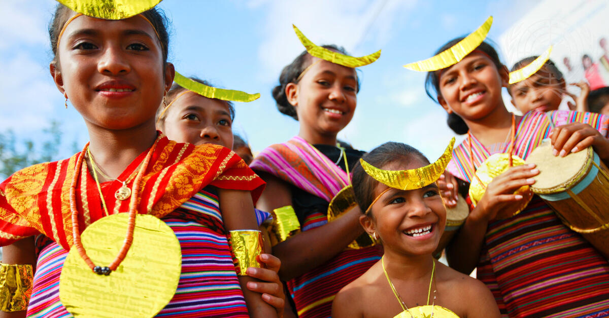 Timorese in traditional dress take part in a ceremony. UN Photo/Martine Perret